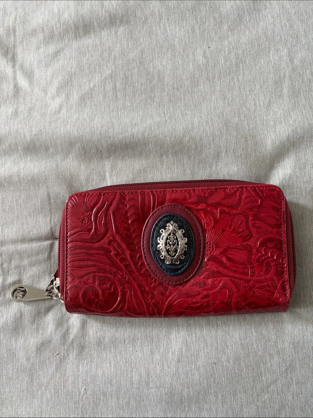 Red Embossed Zip-Around Wallet with Ornate Medallion Accent